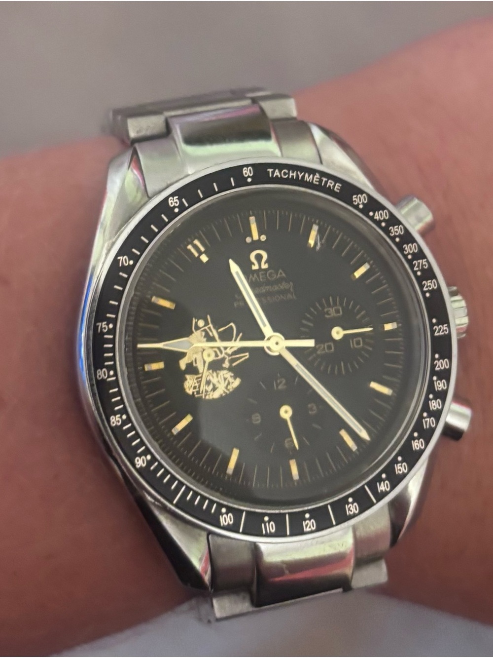 Omega Black Dial Stainless Steel Chronograph Watch with Gold Accents